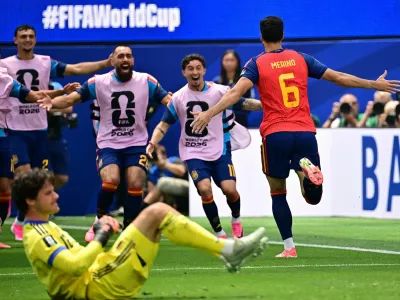 Soccer Football - FIFA World Cup 2026 - Quarter Final - Spain v Belgium - Los Angeles Stadium, Inglewood, California, U.S. - July 10, 2026 Spain's Mikel Merino celebrates scoring their second goal as Belgium's Senne Lammens looks dejected IMAGN IMAGES via Reuters/Gary Vasquez