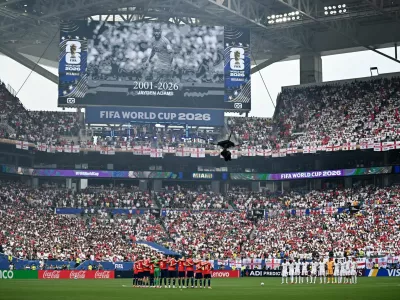 Soccer Football - FIFA World Cup 2026 - Quarter Final - Norway v England - Miami Stadium, Miami Gardens, Florida, U.S. - July 11, 2026 The players stand during a minutes silence in memory of South African's Jayden Adams before the match REUTERS/Dylan Martinez   TPX IMAGES OF THE DAY
