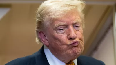 President Donald Trump listens to a question as he speaks with reporters in flight on Air Force One after landing at U.S. Air Force Base at RAF Mildenhall, in Suffolk, Eastern England, Wednesday, July 8, 2026. (AP Photo/Alex Brandon)