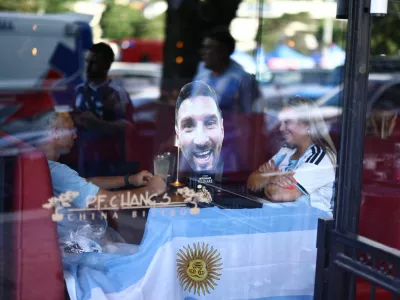 Soccer Football - FIFA World Cup 2026 - Argentina fans gather in Kansas City - Kansas City, Missouri, U.S. - July 10, 2026 A mask of Argentina's Lionel Messi is seen in a restaurant window as fans gather in Kansas City ahead of their quarter final match against Switzerland REUTERS/Lee Smith