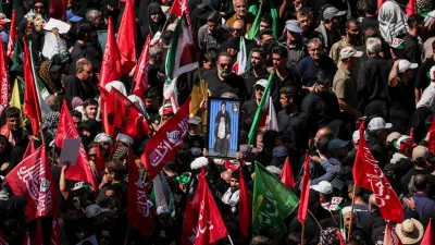 A man raises a picture featuring Iran's Supreme Leader Mojtaba Khamenei and Iran's late Supreme Leader Ayatollah Ali Khamenei, as mourners gather on the day of the burial of Ayatollah Ali Khamenei, who was killed on February 28 in Israeli and U.S. airstrikes, in Mashhad, Iran, July 9, 2026. REUTERS/Alkis Konstantinidis Foreign media in Iran operate under guidelines set by the Ministry of Culture and Islamic Guidance, which regulates press activity and permissions. ISRAEL OUT. NO COMMERCIAL OR EDITORIAL SALES IN ISRAEL. NO ACCESS FOR ISRAELI MEDIA. NO USE BBC PERSIAN. NO USE VOA PERSIAN. NO USE MANOTO. NO USE IRAN INTERNATIONAL. NO USE RADIO FARDA. DIGITAL: NO USE BBC PERSIAN. NO USE VOA PERSIAN. NO USE MANOTO. NO USE IRAN INTERNATIONAL. NO USE RADIO FARDA.