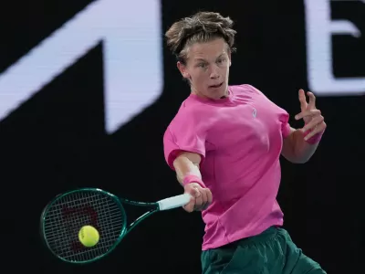 Ziga Sesko of Slovenia plays a forehand return to Keaton Hance of the U.S. during the boy's singles final at the Australian Open tennis championship in Melbourne, Australia, Sunday, Feb. 1, 2026. (AP Photo/Dar Yasin)