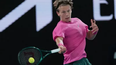 Ziga Sesko of Slovenia plays a forehand return to Keaton Hance of the U.S. during the boy's singles final at the Australian Open tennis championship in Melbourne, Australia, Sunday, Feb. 1, 2026. (AP Photo/Dar Yasin)