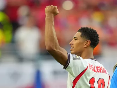 Jude Bellingham celebrates England's victory over Norway in a World Cup quarterfinal soccer match in Miami Gardens, Fla., Saturday, July 11, 2026. (AP Photo/Julio Cortez)
