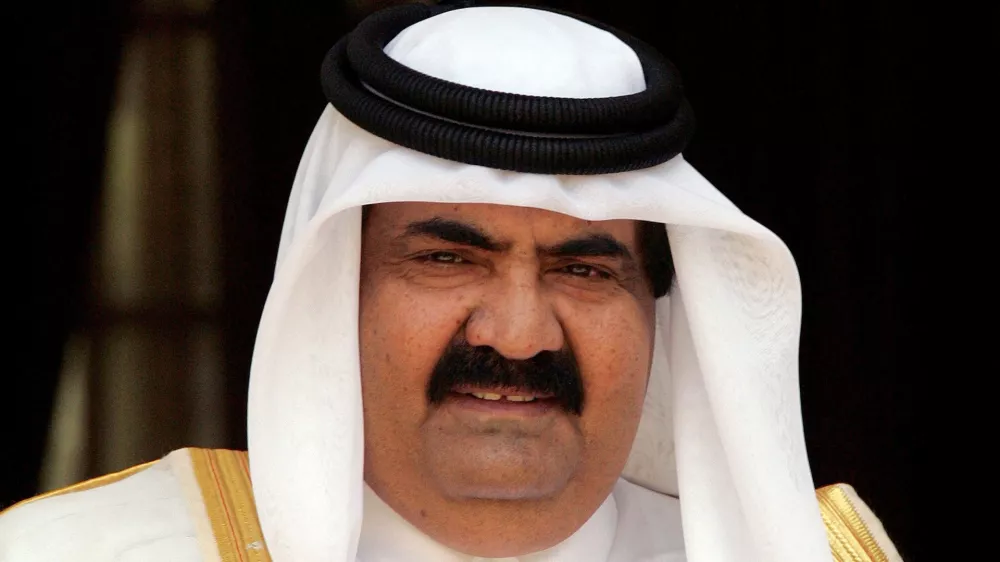 FILE PHOTO: The emir of Qatar, Sheikh Hamad bin Khalifa al-Thani, looks on before his meeting with Indian Prime Minster Manmohan Singh (not in picture) in New Delhi, India April 14, 2005. REUTERS/B Mathur/File Photo