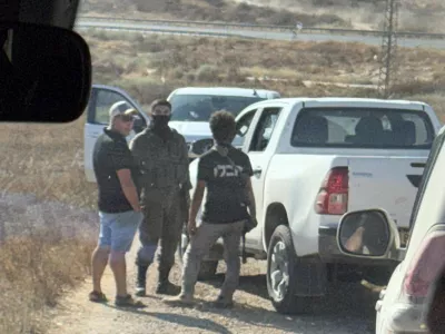 In this photo provided by Cameron Kasky, armed men block the road, stopping vehicles containing U.S. Rep. Ro Khanna, D-Calif., and his delegation near the West Bank village of Khirbet Zanuta, Wednesday, July 8, 2026. (Cameron Kasky via AP)