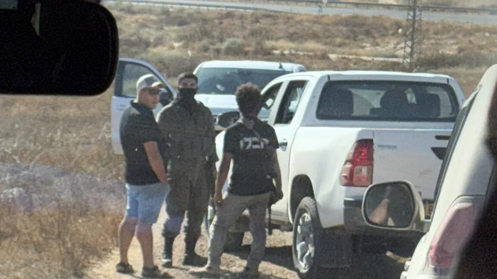In this photo provided by Cameron Kasky, armed men block the road, stopping vehicles containing U.S. Rep. Ro Khanna, D-Calif., and his delegation near the West Bank village of Khirbet Zanuta, Wednesday, July 8, 2026. (Cameron Kasky via AP)