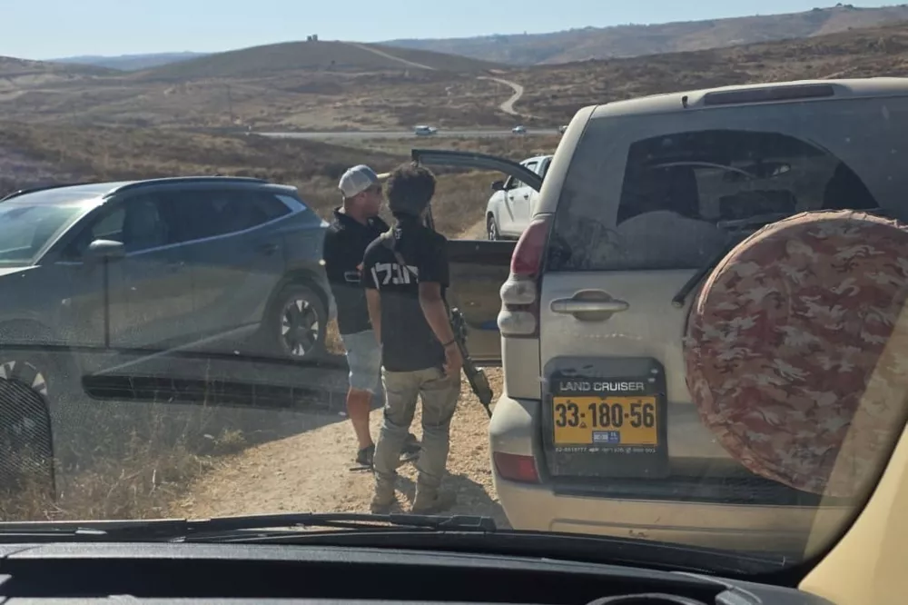 In this photo provided by Cameron Kasky, armed men block the road, stopping vehicles containing U.S. Rep. Ro Khanna, D-Calif., and his delegation near the West Bank village of Khirbet Zanuta, Wednesday, July 8, 2026. (Cameron Kasky via AP)