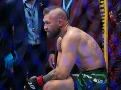 Conor McGregor reacts after losing to Max Holloway in a welterweight fight at the UFC 329 mixed martial arts event Saturday, July 11, 2026, in Las Vegas. (AP Photo/John Locher)