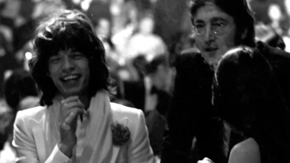 CENTURY CITY, CA - MARCH 13: Mick Jagger, John Lennon and May Pang attend Second Annual American Film Institute Lifetime Achievement Awards Honoring James Cagney on March 13, 1974 at the Century Plaza Hotel in Century City, California. (Photo by Ron Galella/Ron Galella Collection via Getty Images)