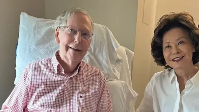 U.S. Senator Mitch McConnell (R-KY) sits with his wife, former United States secretary of labor Elaine Chao, while holding what appears to be the July 12 sports section of the Washington Post in a photograph released by his office in Washington, D.C., U.S. July 12, 2026. Office of Senator Mitch McConnell/Handout via REUTERS.  THIS IMAGE HAS BEEN SUPPLIED BY A THIRD PARTY