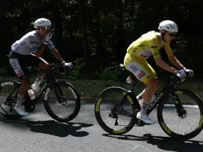Cycling - Tour de France - Stage 9 - Malemort to Ussel - Malemort, France - July 12, 2026 UAE Team Emirates - XRG's Tadej Pogacar wearing the yellow jersey and UAE Team Emirates - XRG's Isaac Del Toro wearing the white jersey in action during stage 9 REUTERS/Gonzalo Fuentes