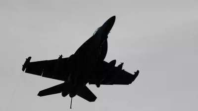 An F-18 fighter jet flies over the USS Theodore Roosevelt as the aircraft carrier participates in Rim of the Pacific (RIMPAC) military exercises in waters south of the Hawaiian Islands, U.S., July 12, 2026. REUTERS/Marco Garcia