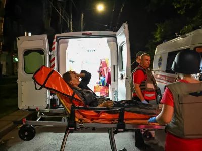 Medical workers evacuate a person from an apartment building hit of a Russian drone strike, amid Russia's attack on Ukraine, in Zaporizhzhia, Ukraine July 12, 2026. REUTERS/Stringer