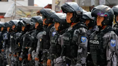 Police officers stand in formation outside El Inca prison after a security operation due to riots, following the disappearance of Jose Adolfo Macias, alias 'Fito', leader of the Los Choneros criminal group, in Quito, Ecuador, January 8, 2024. REUTERS/Karen Toro