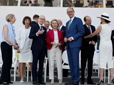 European Commission President Ursula von der Leyen, Luxembourg's Prime Minister Luc Frieden, centre left, and German Chancellor Friedrich Merz, centre right, attend the annual Bastille Day military parade in Paris, France, Tuesday, July 14, 2026. (Benoit Tessier/Pool Photo via AP)