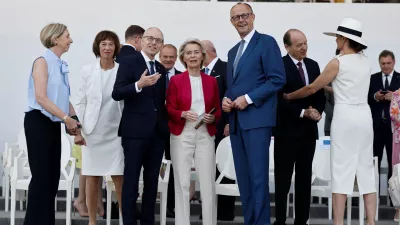 European Commission President Ursula von der Leyen, Luxembourg's Prime Minister Luc Frieden, centre left, and German Chancellor Friedrich Merz, centre right, attend the annual Bastille Day military parade in Paris, France, Tuesday, July 14, 2026. (Benoit Tessier/Pool Photo via AP)