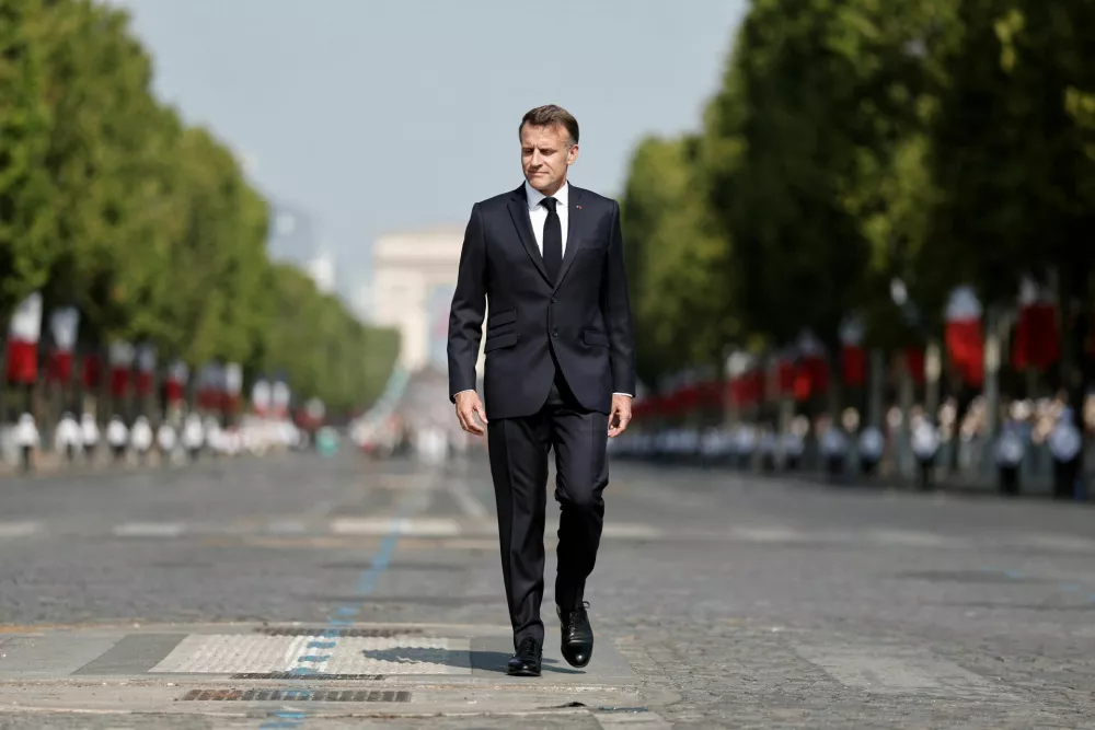 French President Emmanuel Macron reviews the troops on the Place de la Concorde during the annual Bastille Day military parade in Paris, France, July 14, 2026. REUTERS/Benoit Tessier/Pool