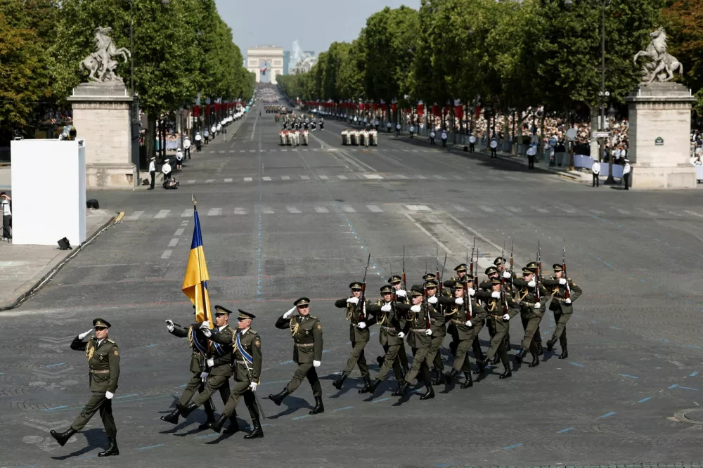 A contingent of Ukrainian soldiers march during the annual Bastille Day military parade on the Champs-Elysees avenue in Paris, France, July 14, 2026. REUTERS/Benoit Tessier