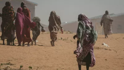 FILE PHOTO: Sudanese refugee women walk at the Tulum refugee camp, amid ongoing conflict in Sudan between the paramilitary Rapid Support Forces (RSF) and the Sudanese army, in Wadi Fira province, eastern Chad, November 30, 2025. REUTERS/Amr Abdallah Dalsh//File Photo