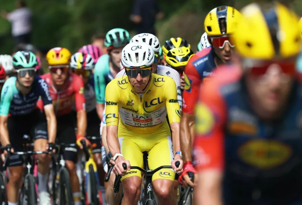 Cycling - Tour de France - Stage 13 - Dole to Belfort - Dole, France - July 17, 2026 UAE Team Emirates XRG's Tadej Pogacar, wearing the yellow jersey, and other cyclists in action during stage 13 REUTERS/Gonzalo Fuentes
