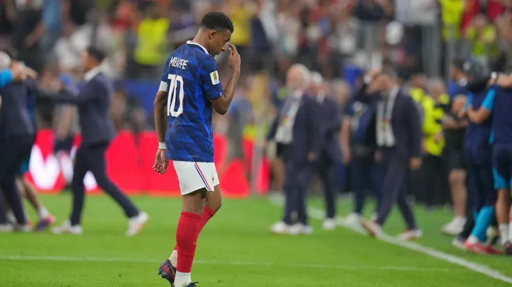 France's Kylian Mbappe walks of the field after his side's lost in a World Cup semifinal soccer match against Spain in Arlington, Texas, near Dallas, Tuesday, July 14, 2026. (AP Photo/Julio Cortez)