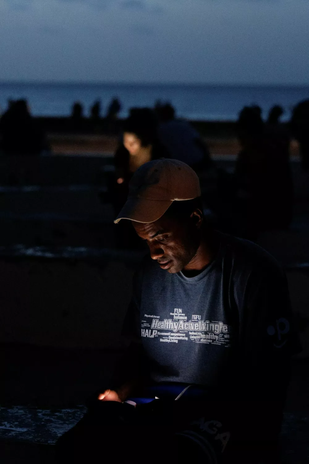 A man checks his phone at a park as Cuba's national power grid collapsed, marking the third major outage in nine days, in Havana, Cuba, July 14, 2026. REUTERS/Norlys Perez