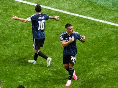 Argentina's Lautaro Martinez (22) and Lionel Messi (10) celebrate after defeating England in the World Cup semifinal soccer match in Atlanta, Wednesday, July 15, 2026. (AP Photo/Lynne Sladky)