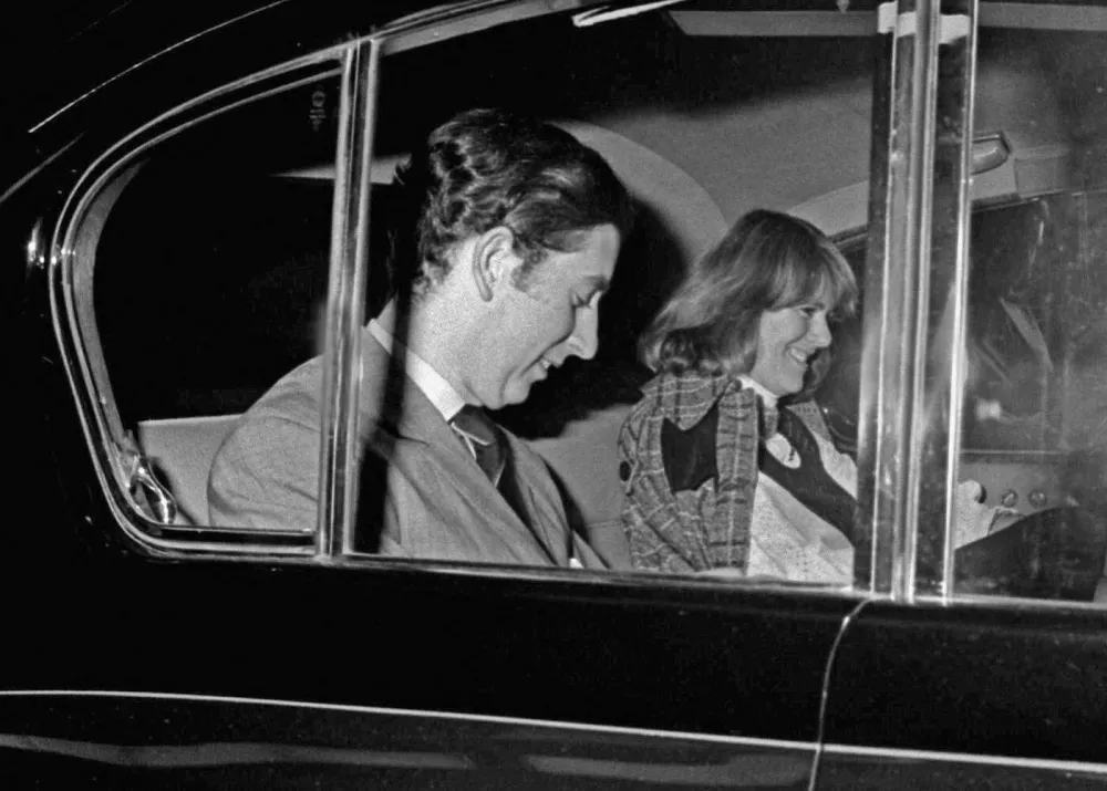Prince Charles and Camilla Parker-Bowles leave the Royal Opera House in Covent Garden on the eve of Valentines Day (13th February) in 1975. A rare image of the Prince and his companion from the early days of their romance.,Image: 87104485, License: Rights-managed, Restrictions:, Model Release: no 