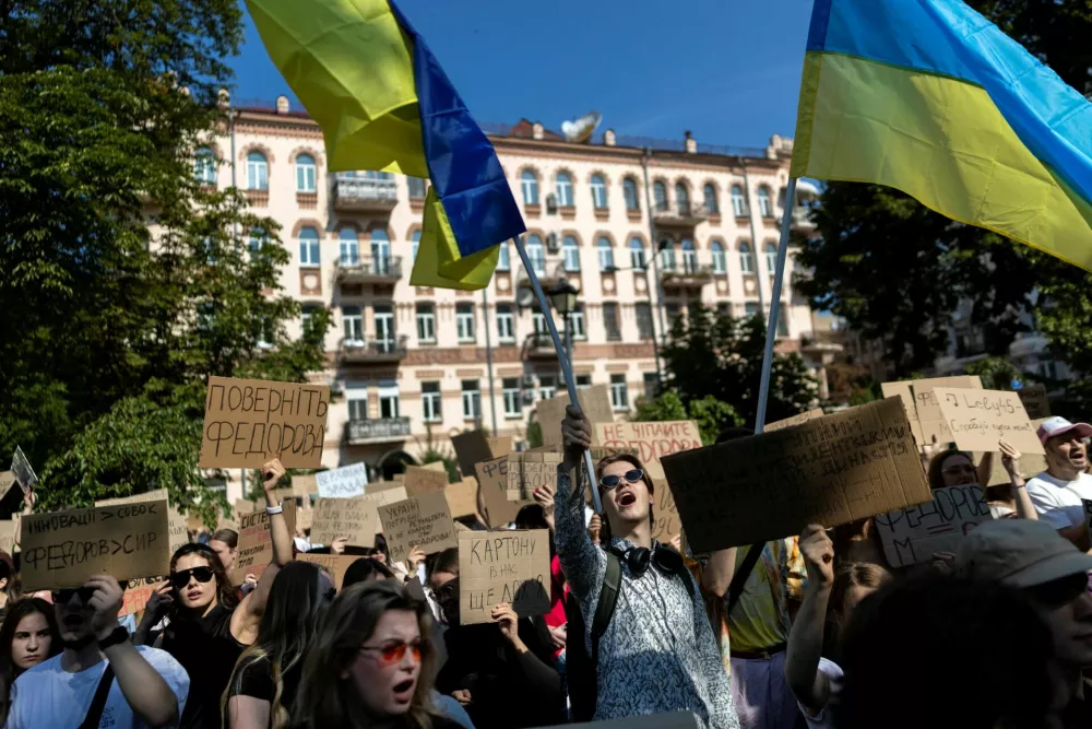 People protest against Ukrainian President Volodymyr Zelenskiy's decision to replace Mykhailo Fedorov as defence minister, amid Russia's attack on Ukraine, in Kyiv, Ukraine, July 16, 2026. REUTERS/Thomas Peter
