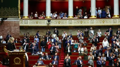 Members of parliament applaud following the result of a vote on the bill establishing a right to medical aid in dying at the National Assembly in Paris, France, July 15, 2026. REUTERS/Abdul Saboor