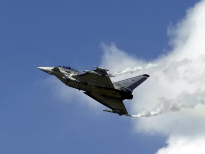 A new Eurofighter Typhoon flies over the International Aerospace Exhibition (ILA) in Berlin-Schoenefeld, Thursday June 8, 2000. The Eurofighter will be produced by the new consortium EADS and British Aereospace. More than 900 companies of 38 countries display the latest technology in aviation and aeronautics at the ILA until June 12. (AP Photo/Sven Kaestner)