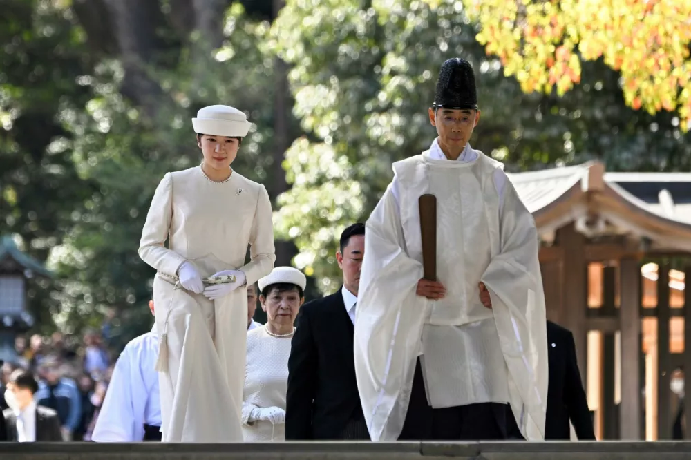 FILE - Japan's Princess Aiko, left, the daughter of Emperor Naruhito and Empress Masako, arrives to mark the 110th anniversary of the death of the wife of former emperor Meiji at Meiji Shrine in Tokyo, on April 10, 2024. (Kazuhiro Nogi/Pool Photo via AP, File)