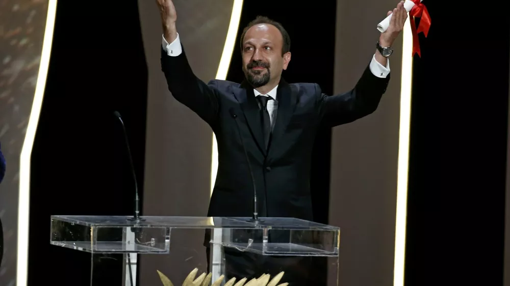 Director Asghar Farhadi, Best screenplay award winner for his film "Forushande" (The Salesman), reacts on stage during the closing ceremony of the 69th Cannes Film Festival in Cannes, France, May 22, 2016.      REUTERS/Eric Gaillard