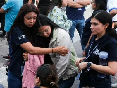 People react after evacuating the Biblioteca Nacional following a powerful 7.4-magnitude earthquake that struck off the coast of Mexico's southern state of Chiapas, triggering a tsunami warning and shaking buildings in neighboring Guatemala and El Salvador, in San Salvador, El Salvador, July 17, 2026. REUTERS/Jose Cabezas