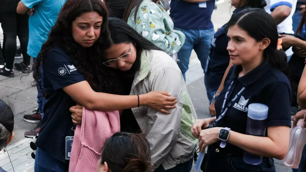 People react after evacuating the Biblioteca Nacional following a powerful 7.4-magnitude earthquake that struck off the coast of Mexico's southern state of Chiapas, triggering a tsunami warning and shaking buildings in neighboring Guatemala and El Salvador, in San Salvador, El Salvador, July 17, 2026. REUTERS/Jose Cabezas