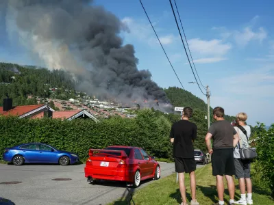 Smoke rises over terraced houses on fire in the Krokstadelva village in Drammen, Norway, Friday. July 17, 2026. (Thomas Fure/NTB Scanpix via AP)