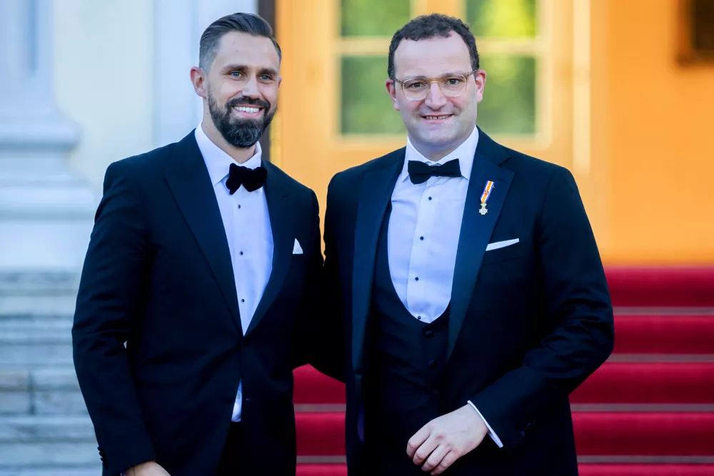 FILE - The then-German Health Minister Jens Spahn, right, and his husband Daniel Funke, left, arrive at Bellevue presidential palace to attend a State banquet hosted by the Federal President and his wife in Berlin, Germany, Monday, July 5, 2021. (AP Photo/Christoph Soeder, File)