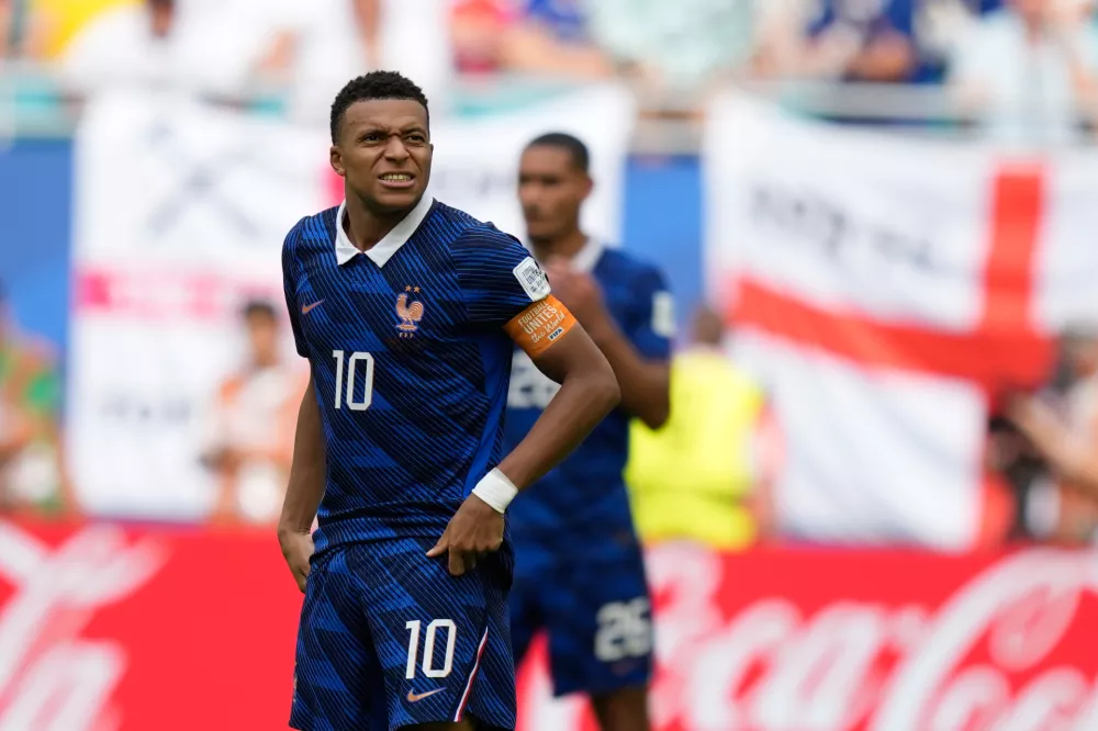 France's Kylian Mbappe (10) reacts during the World Cup third-place playoff soccer match between France and England in Miami Gardens, Fla., Saturday, July 18, 2026. (AP Photo/Rebecca Blackwell)