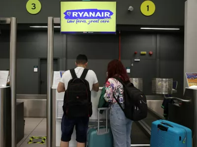 FILE PHOTO: People stand at Ryanair counter, inside the Makedonia airport in Thessaloniki, Greece, May 7, 2026. REUTERS/Alexandros Avramidis/File Photo