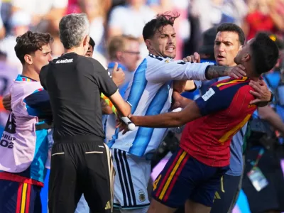 Players brawl during the World Cup final soccer match between Spain and Argentina in East Rutherford, N.J., near New York, Sunday, July 19, 2026. (AP Photo/Julio Cortez)