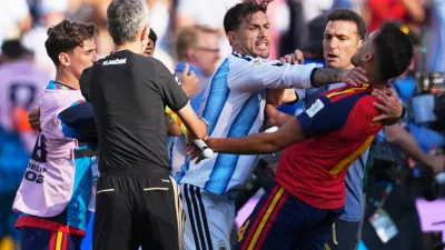 Players brawl during the World Cup final soccer match between Spain and Argentina in East Rutherford, N.J., near New York, Sunday, July 19, 2026. (AP Photo/Julio Cortez)