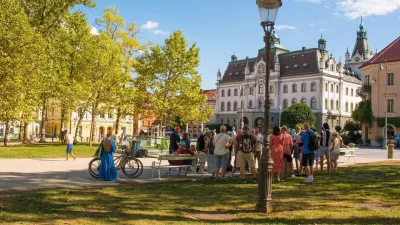 Ljubljana, Slovenia - September 4th 2022. A tour group stops to listen to their guide on a summer afternoon in Park Zvezda in the centre of Ljubljana, Slovenia