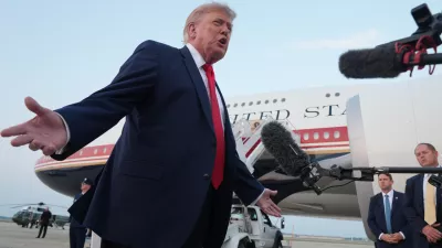 President Donald Trump speaks to reporters as he exits Air Force One at Joint Base Andrews, Md., after attending the World Cup final soccer match, Sunday, July 19, 2026. (AP Photo/Jacquelyn Martin)