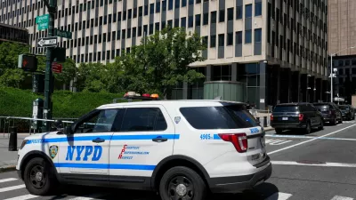 An NYPD police vehicle stands parked outside 26 Federal Plaza, which houses the FBI's New York City field office and the Immigration and Customs Enforcement (ICE) field office, following reports that a person deployed an incendiary device, in New York City, U.S., July 20, 2026. REUTERS/David Dee Delgado