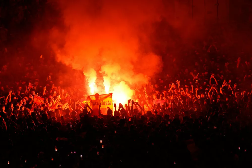 Fans hold flares during celebrations at Cibeles Square in Madrid on Monday, July 20, 2026, after Spain defeated Argentina in the World Cup final in East Rutherford, N.J., near New York. (AP Photo/Bernat Armangue)