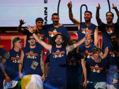 Spain's Marc Cucurella waves during celebrations with his national team teammates at Cibeles Square in Madrid on Monday, July 20, 2026, after Spain defeated Argentina in the World Cup final in East Rutherford, N.J., near New York. (AP Photo/Manu Fernandez)