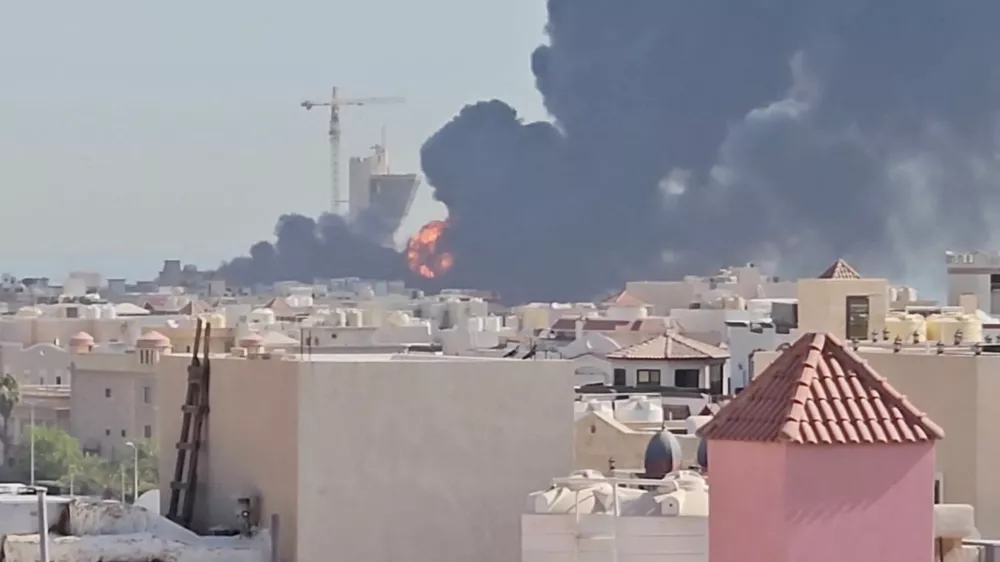 Smoke billows near the oil facility in Mangaf, Kuwait, July 18, 2026, in this screen grab obtained from a social media video. Social Media/via REUTERS THIS IMAGE HAS BEEN SUPPLIED BY A THIRD PARTY. MANDATORY CREDIT. NO RESALES. NO ARCHIVES. NEWS USE ONLY. Verification lines: - Tower, mosque, and buildings matched satellite and archive imagery. - Date verified by statement from Kuwait Petroleum Corporation that one of its oil facilities had been hit in "repeated Iranian attacks," causing significant damage and some injuries, according to the state news agency. - The area where the smoke is shown in the video is marked as a Kuwait Petroleum Company facility on Google maps.