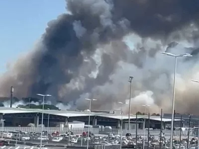 Smoke rises near the Bordeaux-Merignac Airport in France, July 21, 2026, in this screengrab obtained from a social media video. @hichem33600/via REUTERS THIS IMAGE HAS BEEN SUPPLIED BY A THIRD PARTY. MANDATORY CREDIT. NO RESALES. NO ARCHIVES. VERIFICATION: Reuters was able to verify the location through buildings, and light posts that matched satellite and archive imagery. Coordinates: 44.8311953, -0.7017427. The date was confirmed through original file metadata and corroborating media and eyewitness visuals that show the fire near the airport. Local media reported the fire broke out near the Bordeaux-Merignac Airport in France on July 21