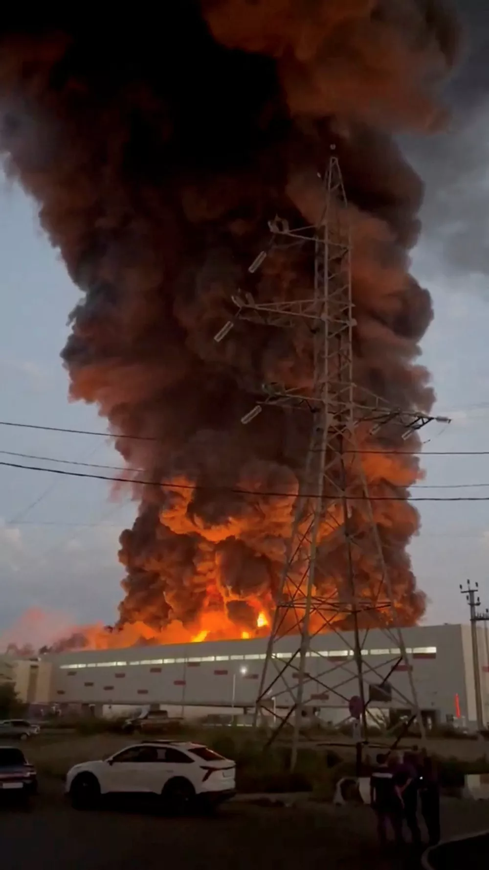 Smoke rises from a Wildberries warehouse on fire after an attack in Nevinnomyssk, Russia, July 22, 2026, in this still image obtained from social media video. Social Media/via REUTERS THIS IMAGE HAS BEEN SUPPLIED BY A THIRD PARTY. NO RESALES. NO ARCHIVES. NEWS USE ONLY.    TPX IMAGES OF THE DAY.  VERIFICATION: - Building exterior, utility poles and towers, and road layout matched archive and satellite imagery. - Corroborating footage showed smoke rising from the same location. - The governor of Stavropol region Vladimir Vladimirov said on Telegram on July 22 that a drone attack on the outskirts of Nevinnomyssk resulted in fire in a warehouse complex. - Tatyana Kim, the head and co-founder of Wildberries, posted on Telegram on July 22 that the company's logistic centers in Krasnodar and Nevinnomyssk were attacked. - No older versions of the video found posted online before July 22.